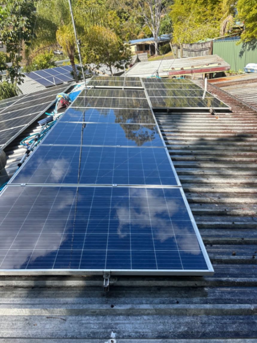 Panels washed up clear, reflecting the sky again