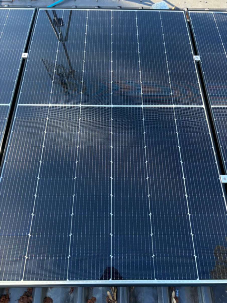Panels cleared of debris and washed spotless